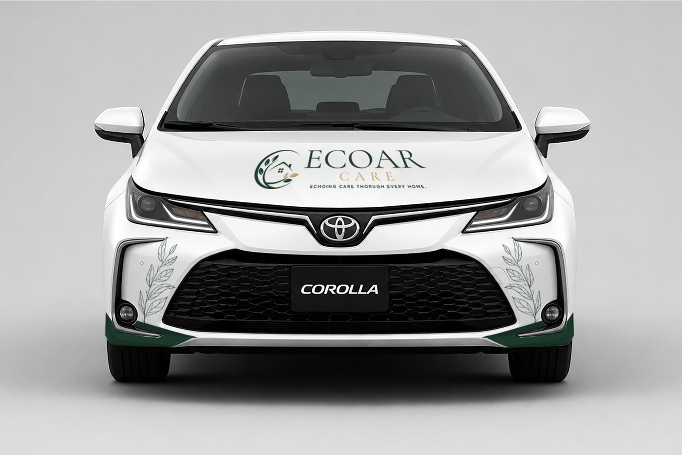 The ECOAR Care car, wrapped in white and forest green, with the logo across the hood